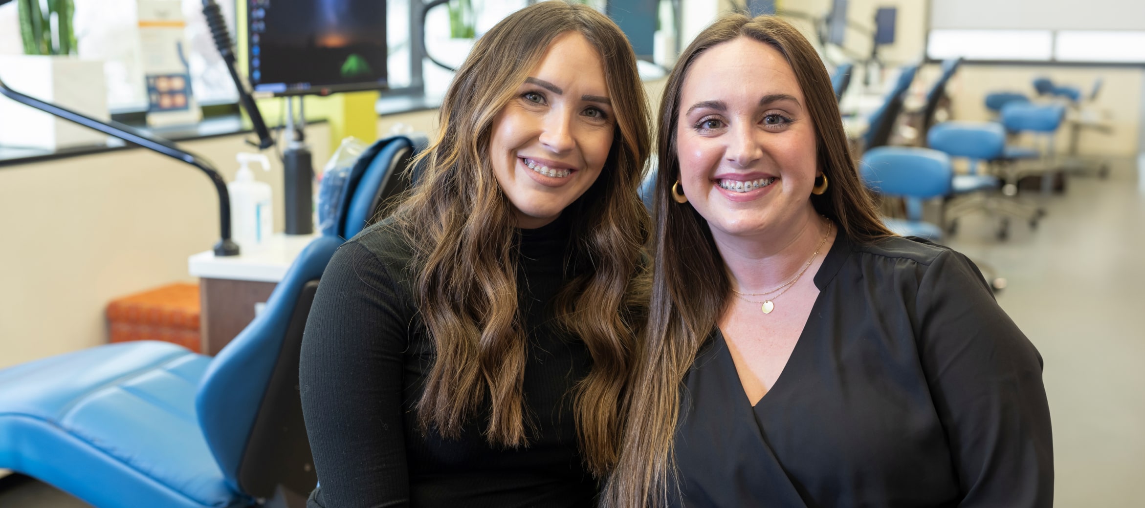 Two team member smiling